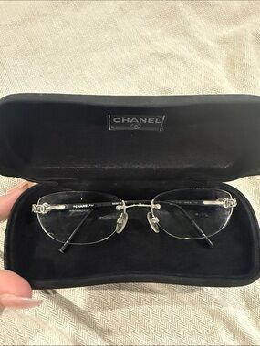 CHANEL Rimless Glasses with Silver Accents and Black Temples